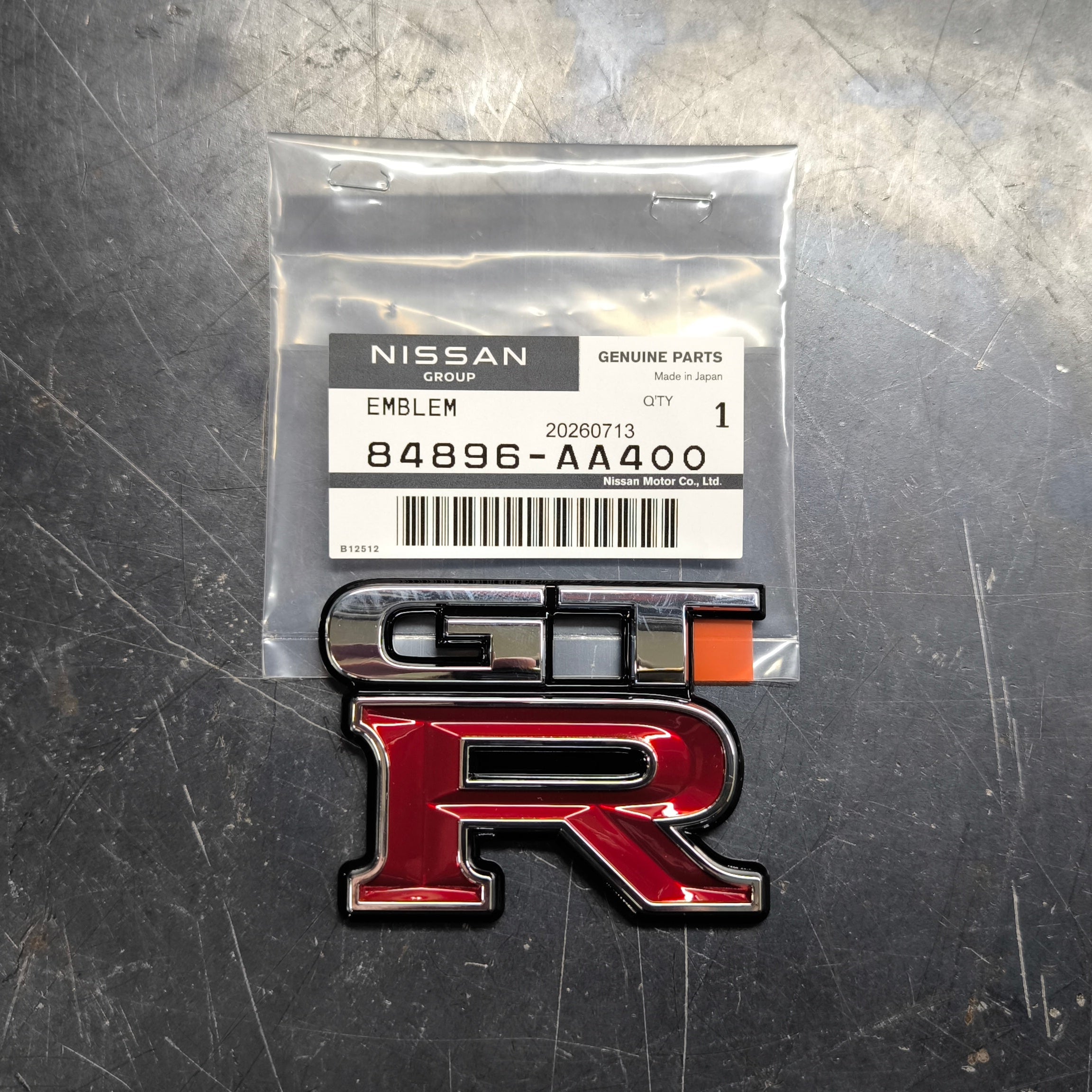 Genuine Nissan Skyline R34 GT-R rear trunk emblem 84896-AA400